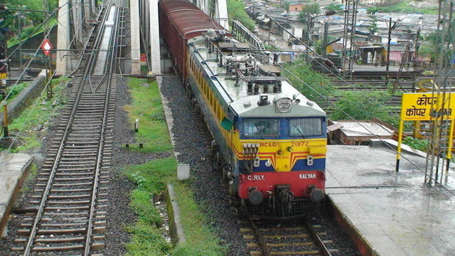 Photo of KYN WCAG1 21972 with a long BCNA rake taken from the foot overbridge of Kopar upper station & also doing good speed