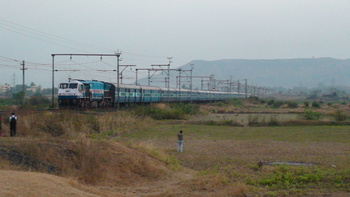 6530 Udyan Express being pulled by KJM WDP4# 20034 (my most favourite loco) passes gracefully during sunset at Shelu outer. 