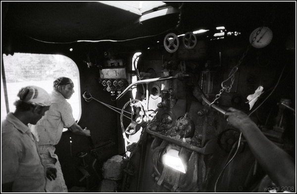 Monochrome images of men and machines at work in the steam age.