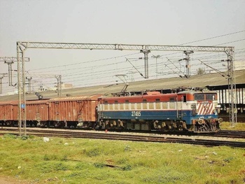 AJNI WAG-7 #27485 Tigerface livery with BCNA rake crossing through Adarshnagar,Delhi.Loco has neat livery and has a "Static