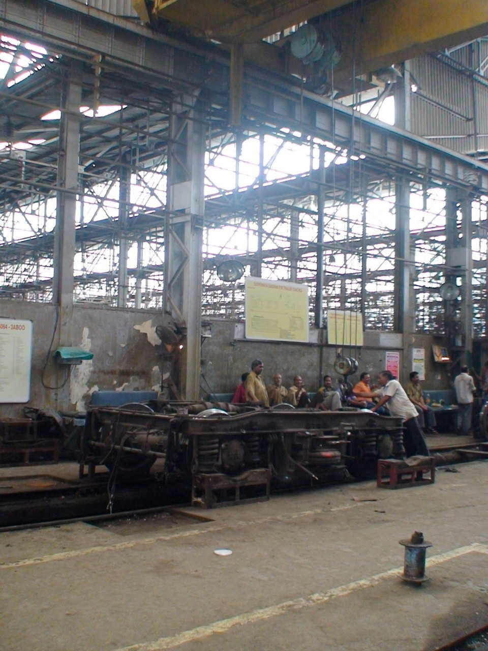 A wheel set will be lifted up shortly by jack lifting machine. A worker at the Bct workshop just makes sure that everything is a