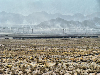 Baluchistan express near Quetta with a backcrop of brick kilns