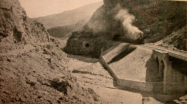 A train steams over the reconstructed Bolan Pass railway line. William Edge, ~1890.