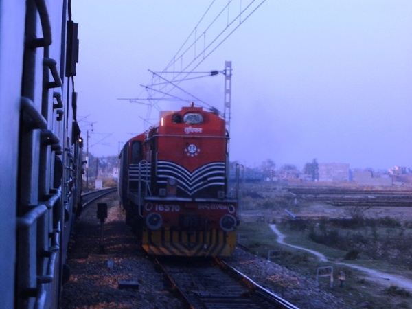 WDM-3A #16370 christened 'Sher Punjab' of Ludhiana shed seen with 12876 Neelachal Express outside Utraitia Junction on 2012-02-1