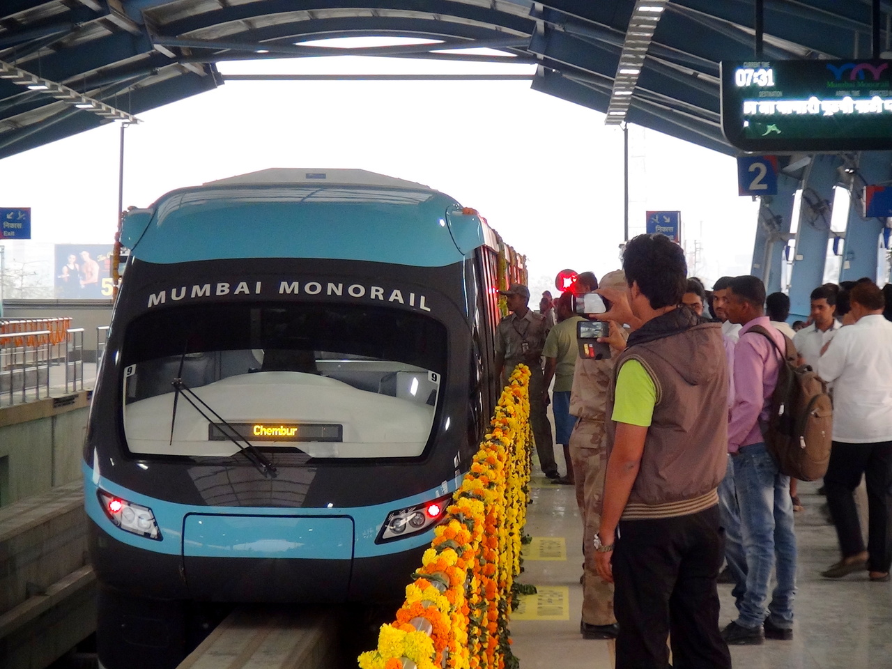 A close up shot of beautiful looking Monorail being photographed at Chembur. People of all ages were seen in action taking pics 