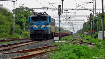 Ludhiana WAG 7 # 27848 hauling empty Flat Bed rakes in Tow at Misrod ( For Loco Database) (Ammar Rizvi)