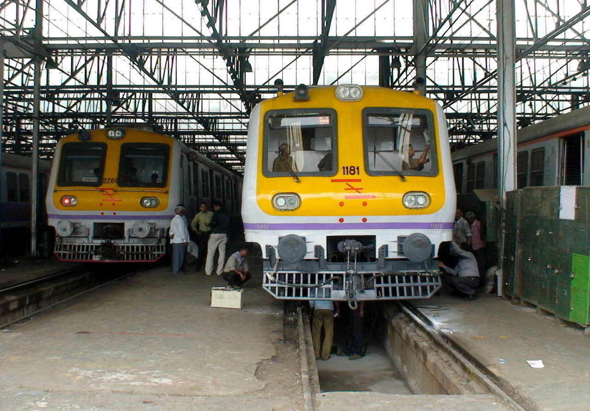 Workers inspecting/studying and doing some repairing of the brand new Siemens rake no 1181 at Mumbai Central Emu Workshop which 