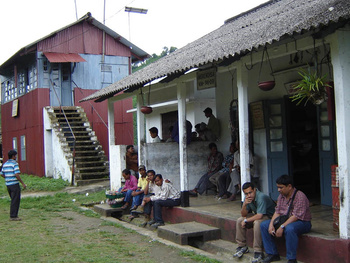 Samit and Bharat kill time at Migrendisa. Note the corrugated tin signal cabin, a feature of the Hill Section