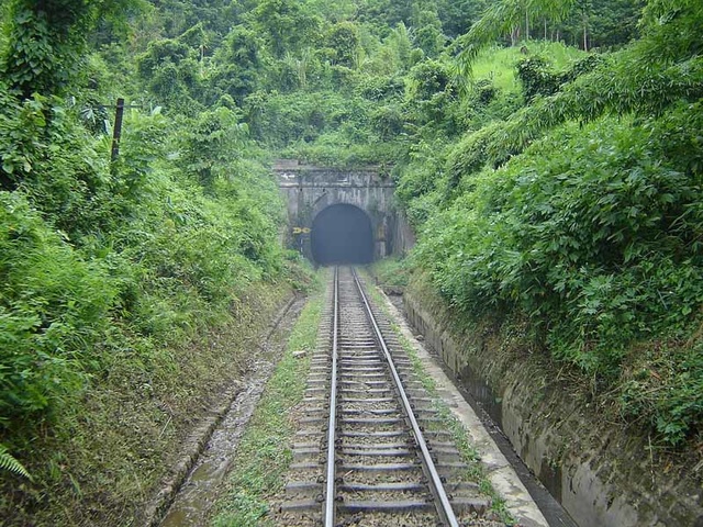 Having just consumed a train a tunnel in the Hill Section belches diesel exhaust