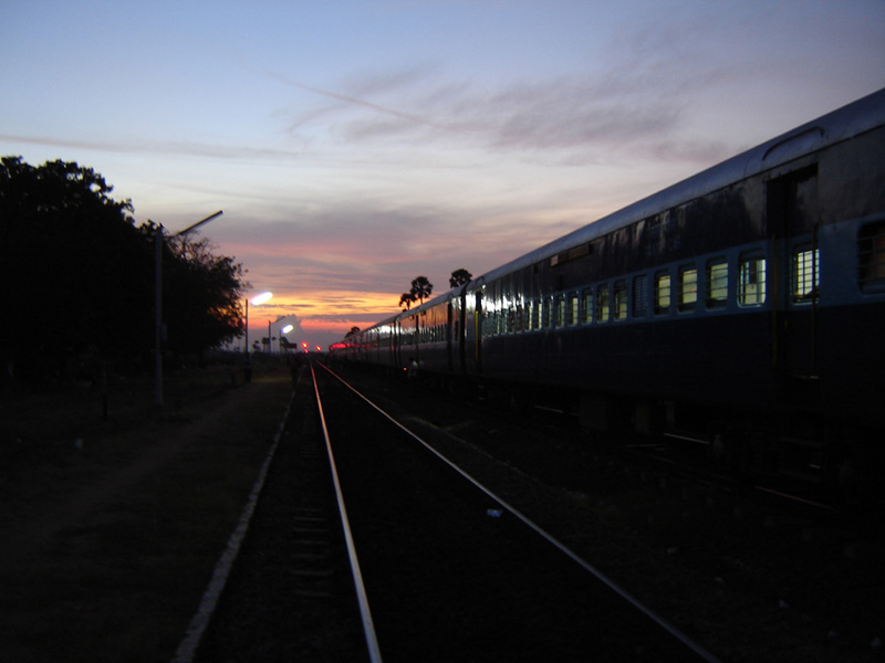 The Guruvayur Express halts for a crossing with the Nellai Express at Naraikkinar