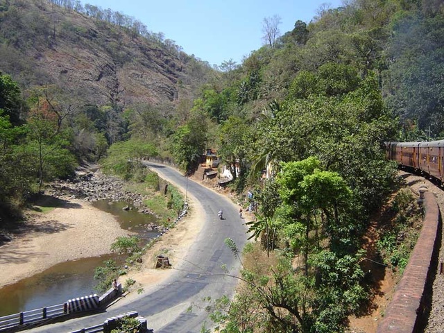 Road and railway have to thread their way through the same narrow pass