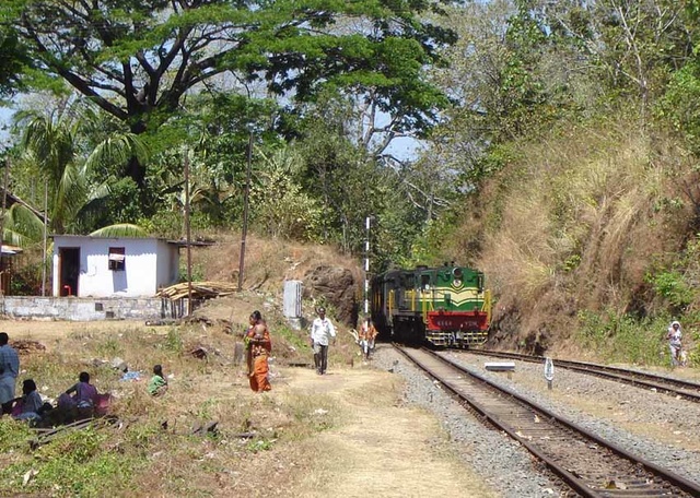 750 Passenger emerges from a narrow cutting into Tenmalai yard