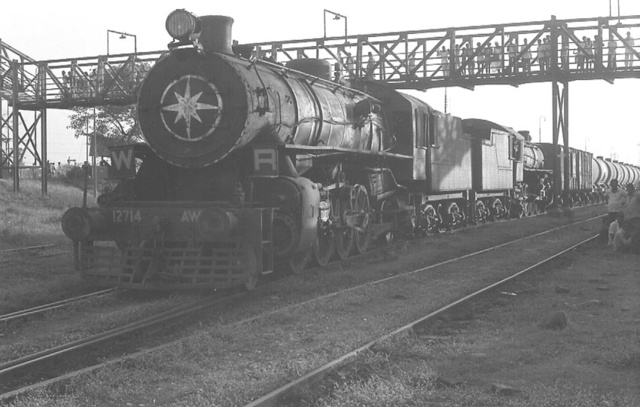 AWD locomotives coupled back to back at on a tanker train at Wadala Road - Mick Pope(Dec. 28, 1979)