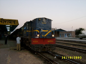 The_loco_had_just_hauled_the_ajmer_purna_passenger_the_driver_can_be_seen_emptying_his_water_bottle.jpg