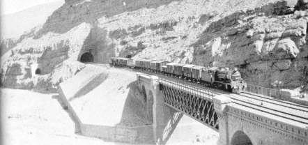 H/G class locomotive hauling a goods train on the Elgin bridge, in the Dozan range of the Bolan Pass.